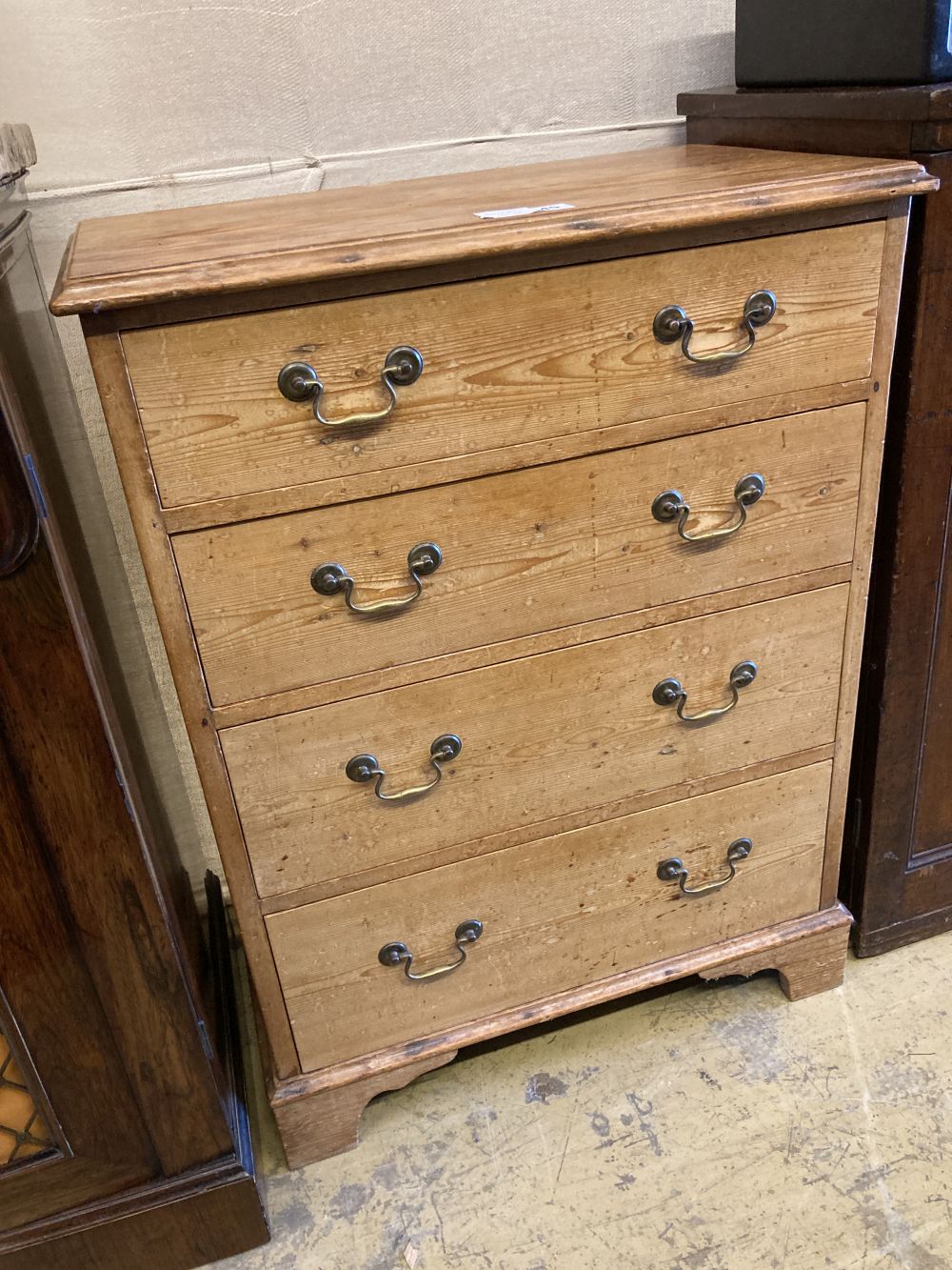 A small Georgian style stripped pine chest of drawers, width 64cm, depth 39cm, height 86cm
